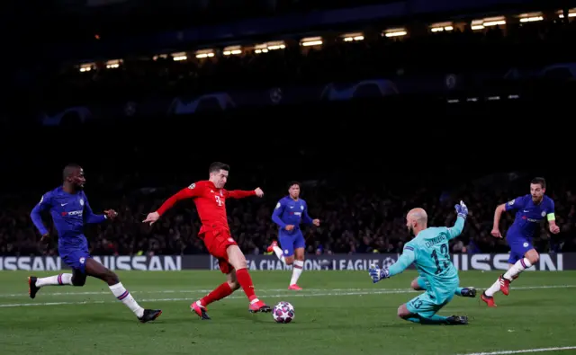 Bayern Munich's Robert Lewandowski shoots at goal