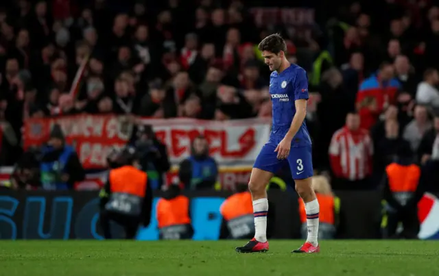 Chelsea's Marcos Alonso leaves the pitch after being shown a red card by referee Clement Turpin