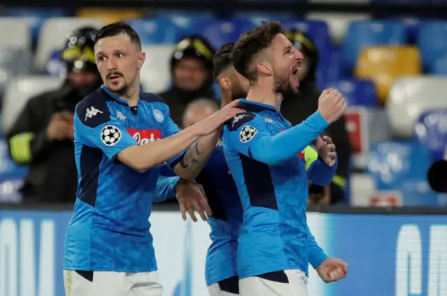 Napoli's Dries Mertens celebrates scoring their first goal with Mario Rui and teammates