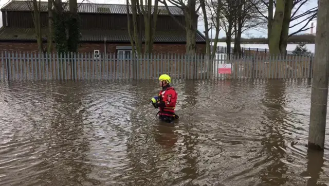 A firefighter in water