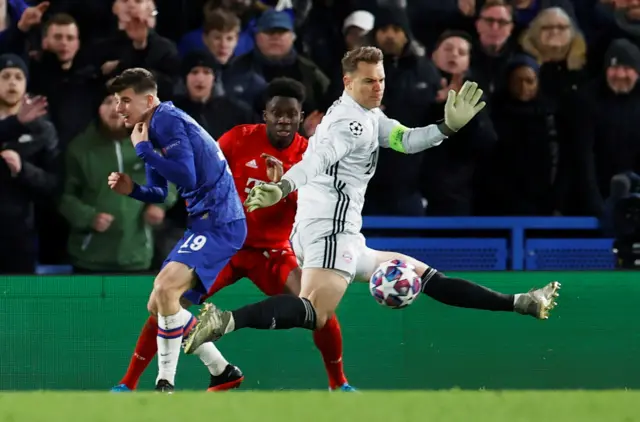 Bayern Munich's Manuel Neuer makes a save a shot from Chelsea's Ross Barkley