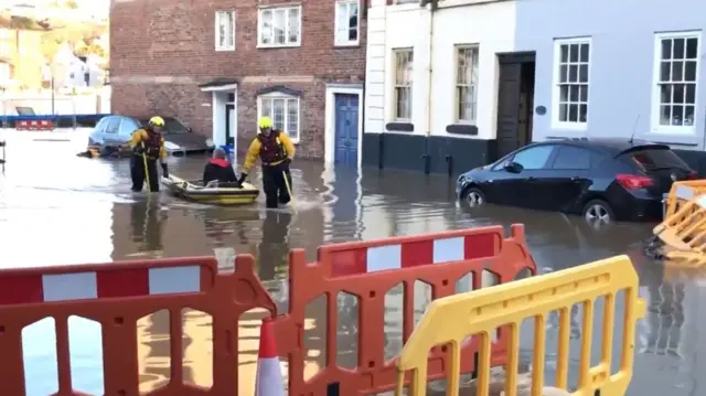 Fire crews rescuing woman