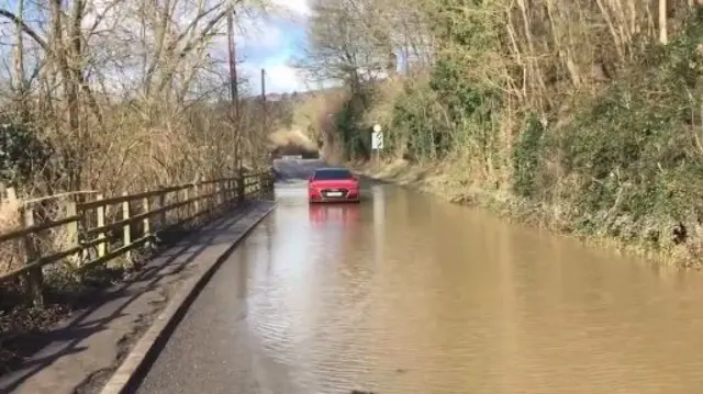 Car stuck in road