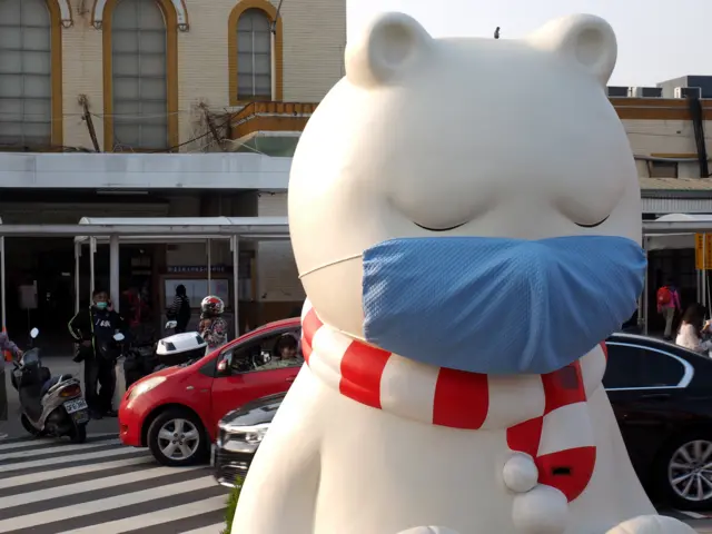 An art installation called The Sleeping Bear reminds people to wear face masks in Taiwan