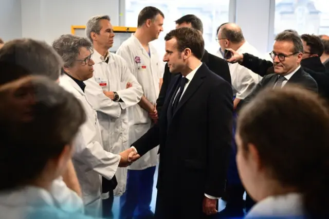 President Emmanuel Macron visits the Pitie-Salpetriere hospital in Paris on Thursday