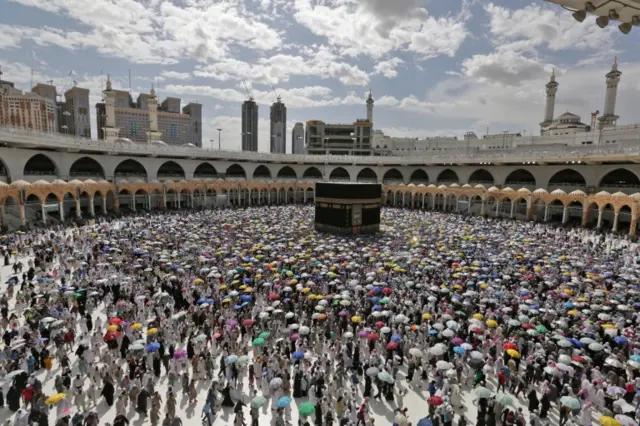 Muslim pilgrims circle around the Kaaba at the Masjidil Haram, Islam"s holiest site during the Hajj pilgrimage in Mecca, Saudi Arabia, 13 August 2019