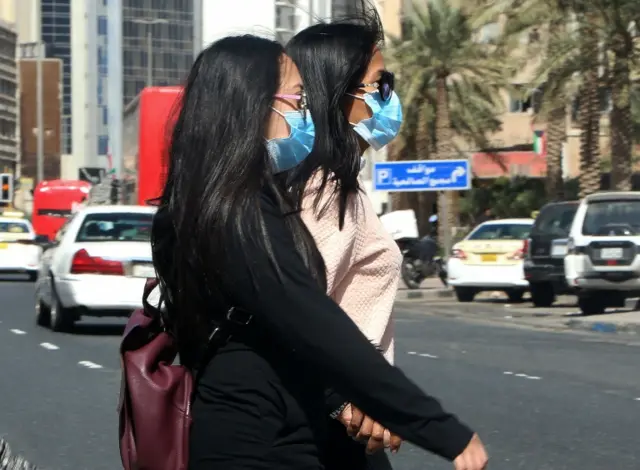 Women wears masks in Kuwait