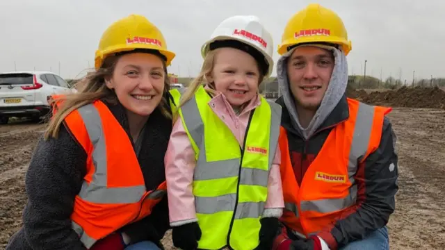 Ella, with her mum Georgia and dad Kieran