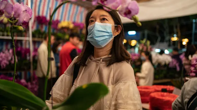 Woman wearing face mask in Hong Kong