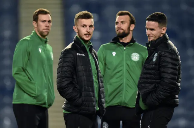 Hibs players take a wander round the Ibrox pitch before kick off