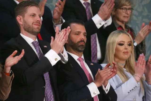 Trump Jr (centre) watches his dad's speech to Congress on Tuesday