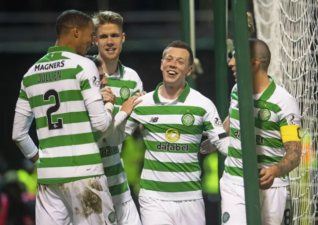 Callum McGregor is congratulated by his Celtic team-mates