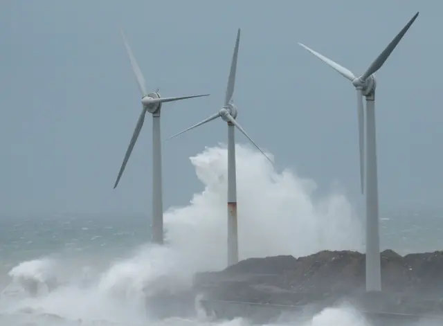 Waves crash against wind turbines during Storm Ciara at Boulogne-sur-Mer, France