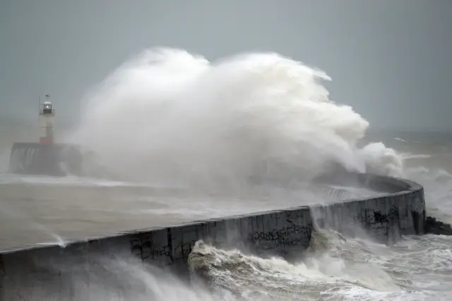 Waves crash into the wall at Newhaven in East Sussex