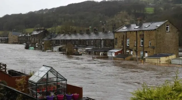 Flooded houses in Mytholmroyd, northern England, after the River Calder burst its banks