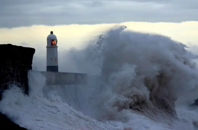 Porthcawl lighthouse surrounded by large waves