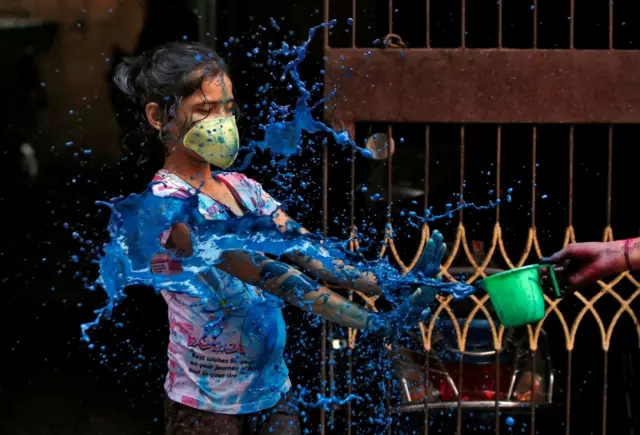 A girl wears protective masks in Chennai