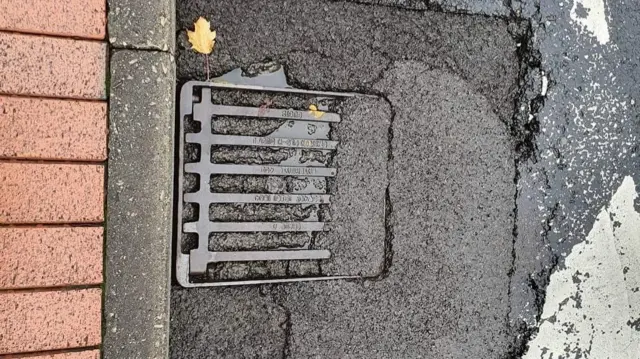 Drain filled with tarmac