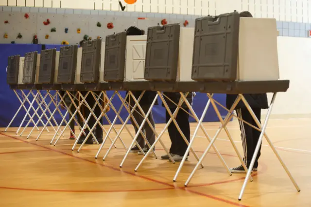 Voters cast their ballots at a polling place at Cromie Elementary School on 10 March, 2020