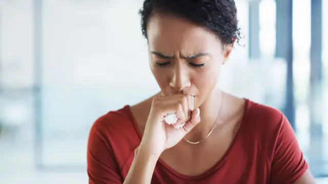 Woman coughing