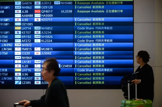 This picture showing widespread cancellations was taken at Haneda airport in Tokyo this morning.