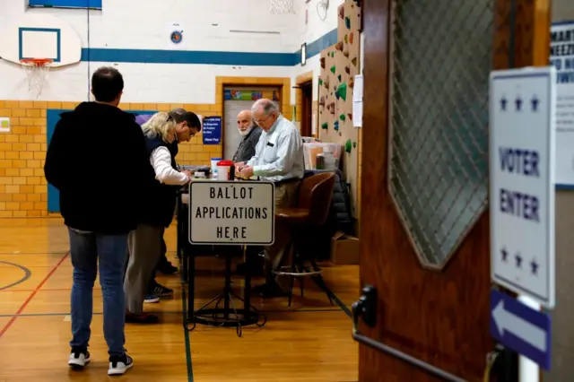 People vote in the Michigan primary election at Lewis E Marie Elementary School in Grosse Pointe, Michigan, on 10 March, 2020