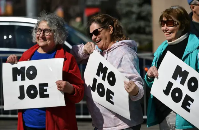 Supporters hold up signs before Democratic presidential candidate Joe Biden holds a rally at Kiener Plaza Park in St. Louis, Missouri on 7 March, 2020