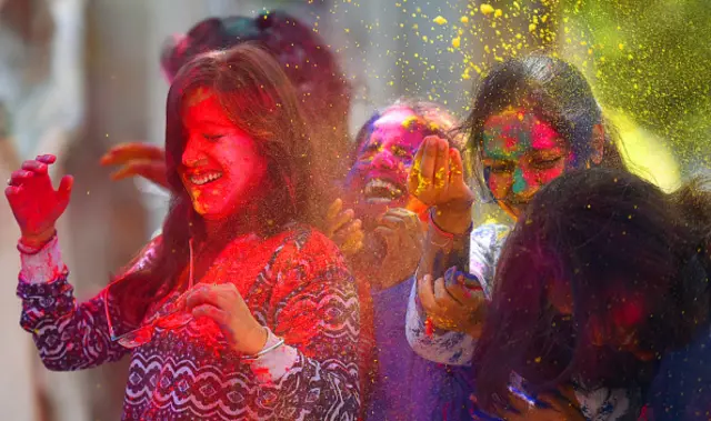 Students seen playing with colours on the eve of Holi festival at Deen Dayal Upadhyaya Institute, ITO, on March 9, 2020 in New Delhi, India.