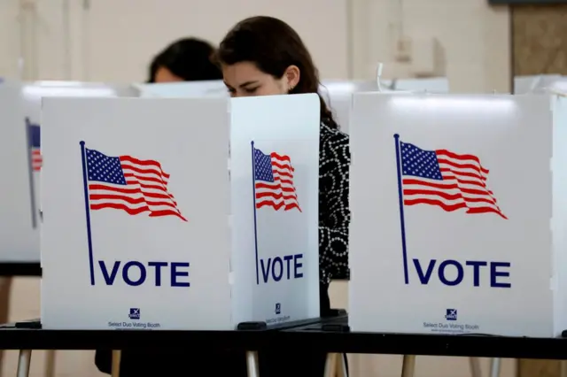 People vote in the Michigan primary election at Chrysler Elementary School in Detroit, Michigan, on 10 March 2020