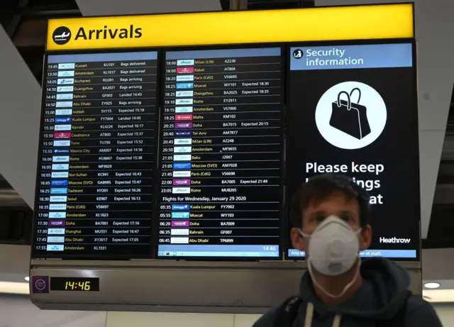 Passenger with facemask at Heathrow