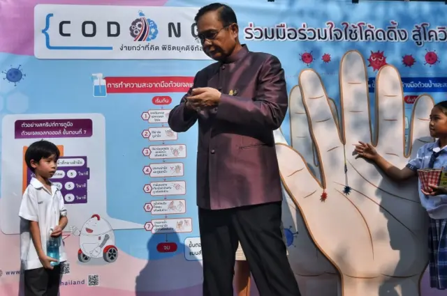 Thai Prime Minister Prayut Chan-O-Cha  washing hands