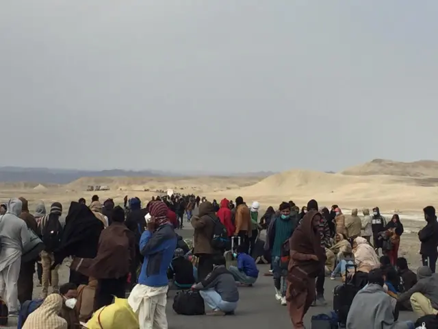 Long queues of mostly pilgrims snake all the way to the border