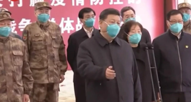 Chinese President Xi Jinping (centre) visits Wuhan