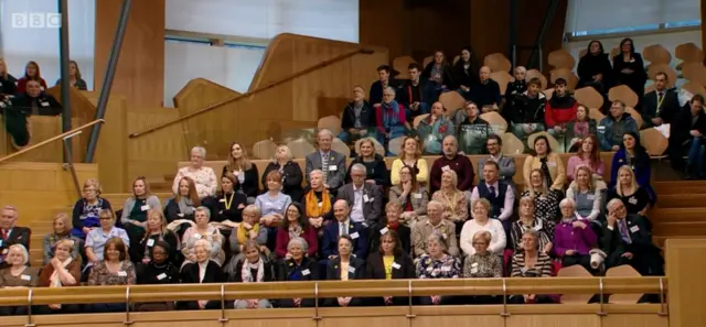 Marie Curie volunteers in the gallery