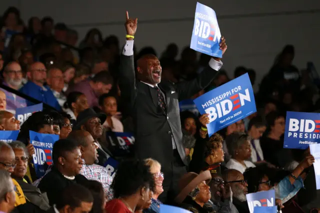 A supporter holds a sign during a campaign event for Democratic presidential candidate former Vice President Joe Biden on 8 March, 2020 in Tougaloo, Mississippi.