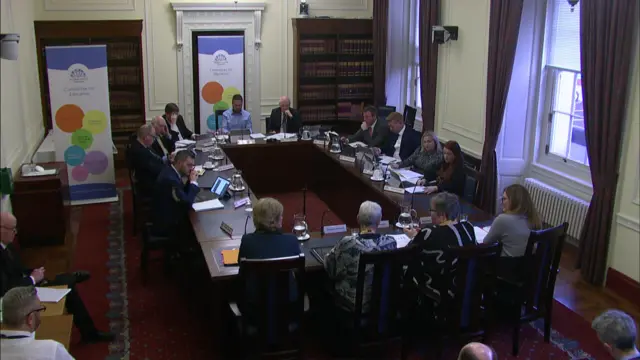 Wide shot of committee