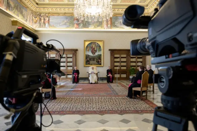 Pope Francis being filmed