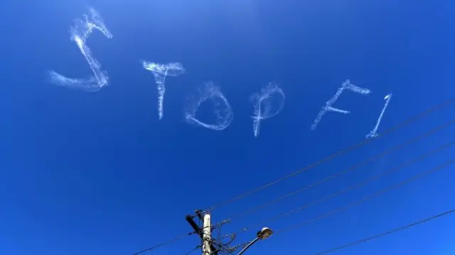 "Stop F1" is written above Sydney