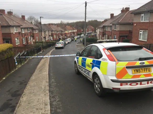 A police car on Woodthorpe Road