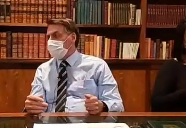 Jair Bolsonaro pictured wearing a mask