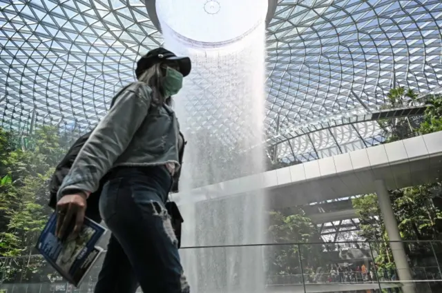 A woman wearing a mask at Singapore's Changi airport