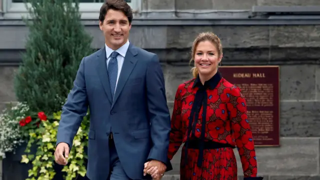 Canada's PM Justin Trudeau and his wife Sophie Gregoire Trudeau leave Rideau Hall in Ottawa, 13 March 2020