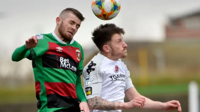 Glentoran's Ruaidhri Donnelly battles with Crusaders' Jordan Forsythe during the Premiership encounter last month