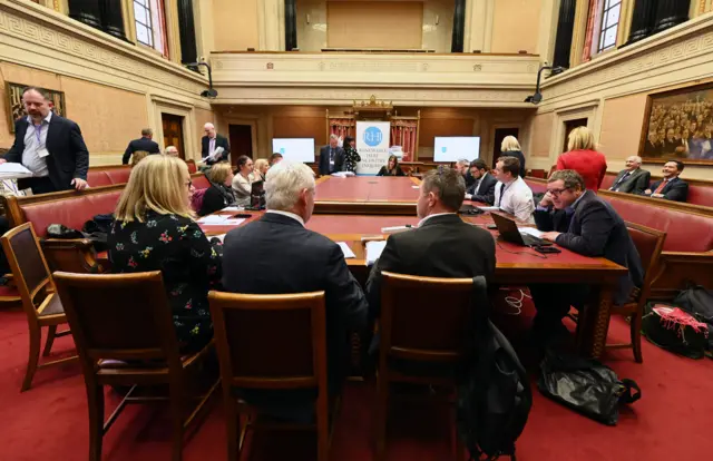 The media gathered in Stormont's Senate Chamber