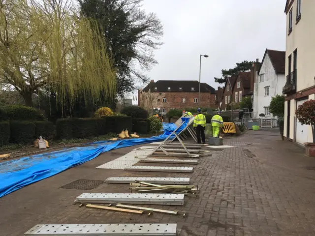 Flood defences come down