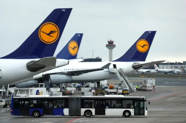 Lufthansa planes parked at an airport