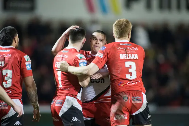 Salford celebrate the try from Niall Evalds