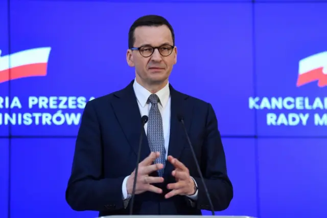 Polish Prime Minister Mateusz Morawiecki attends a press conference on the coronavirus