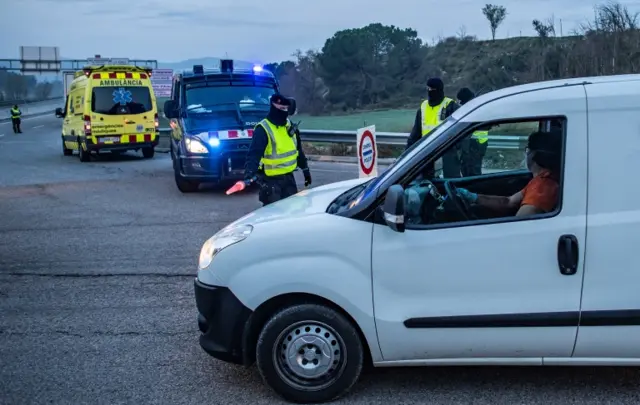 Police officers at a check point near Igualada, Spain