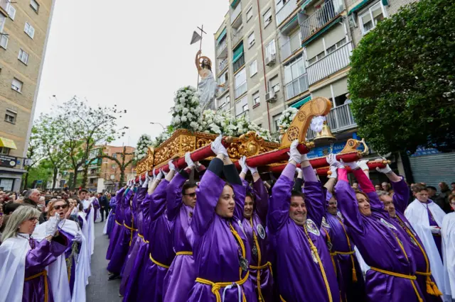 People carry a float during Holy Week in Madrid 2019